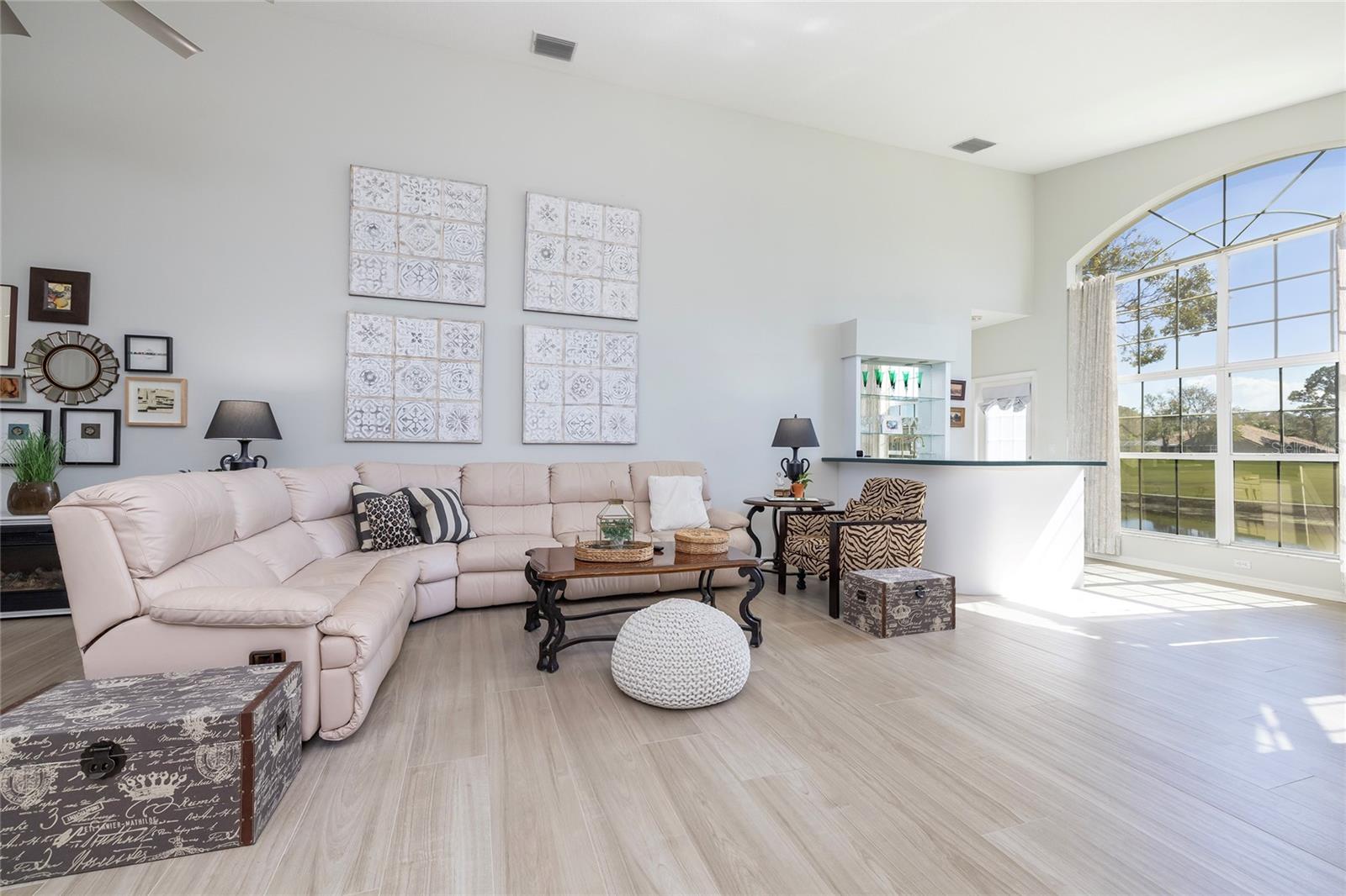 Gathering room with expansive window to the golf course