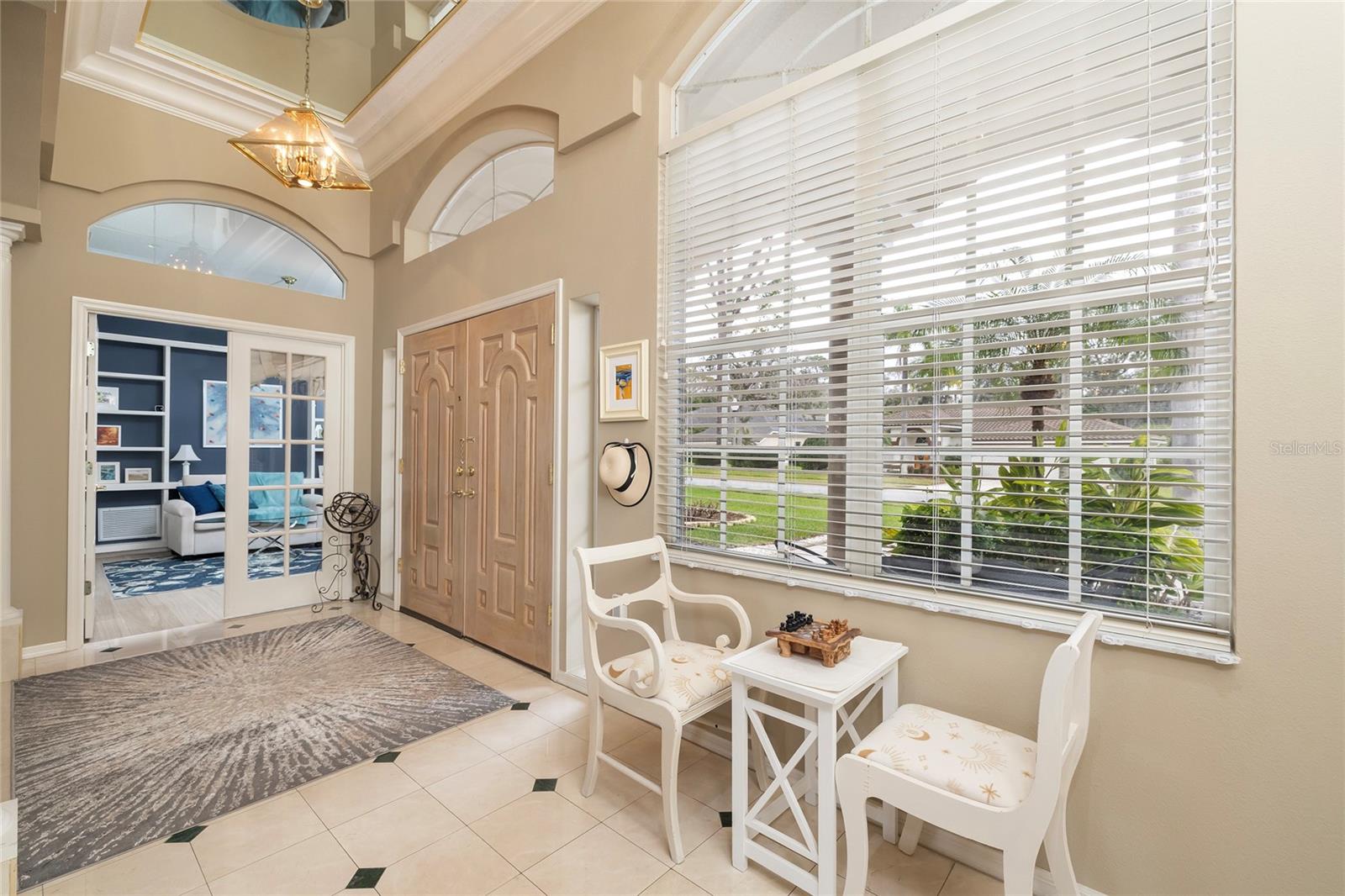 Foyer with office/bedroom 5 with French door entrance