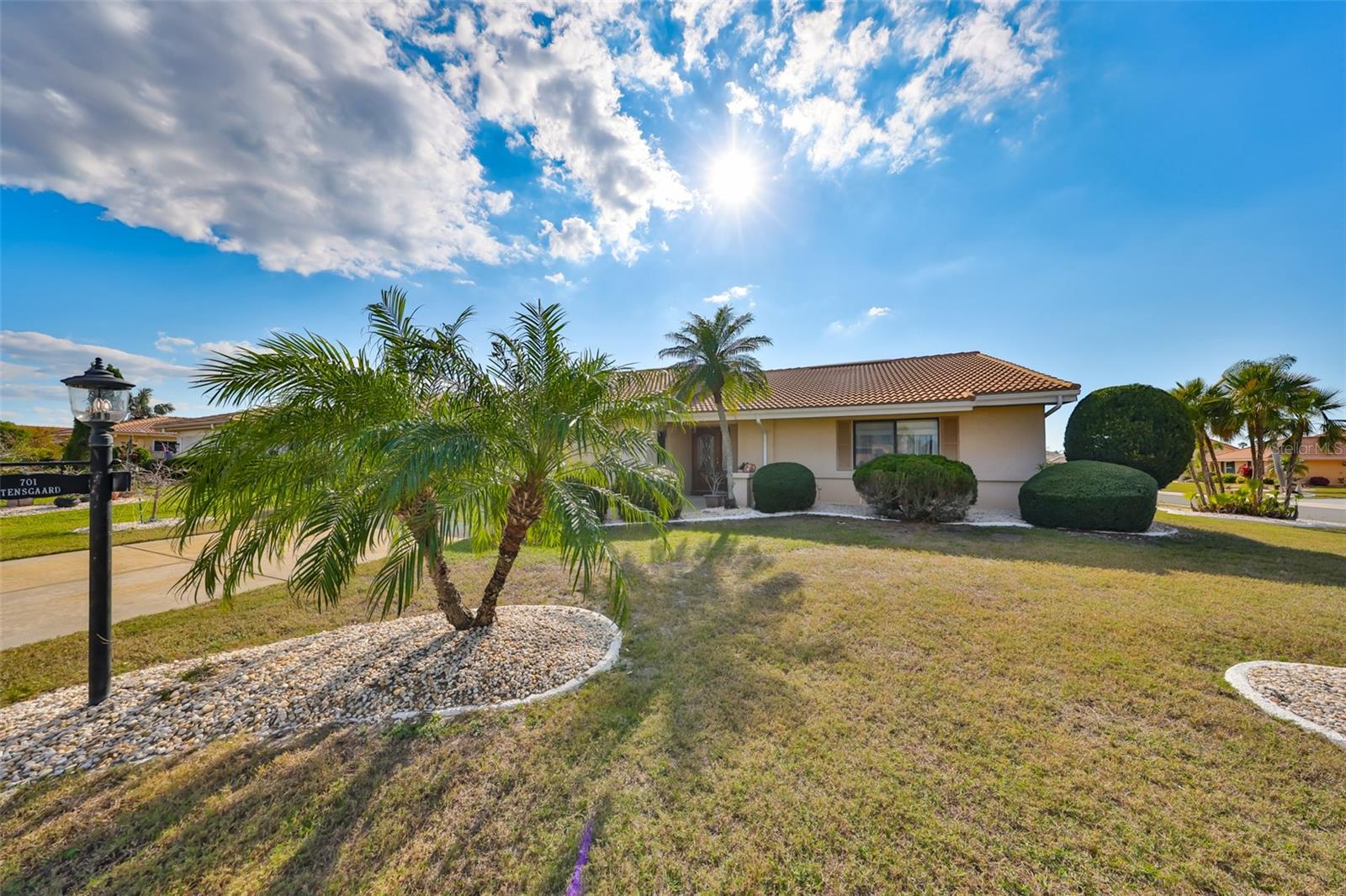 Beautifully landscaped and custom curbing make for easy lawn maintenance.