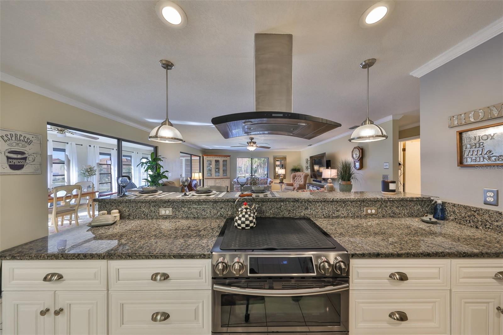 A chef's overhead venting system and high-end appeal makes this kitchen a real joy to be in.