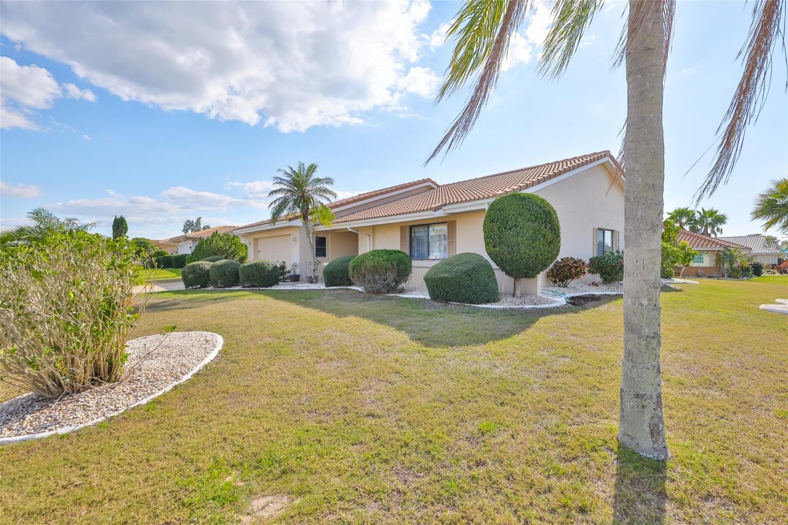 Professional curbing and easy maintenance landscaping surround the home.