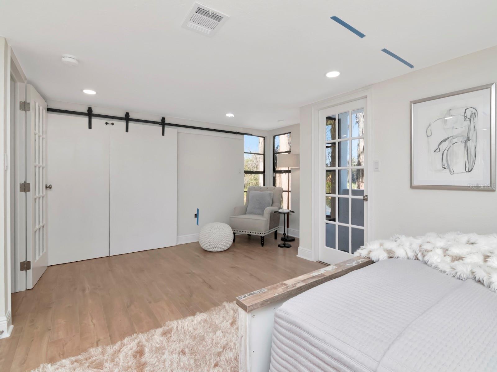 Barns door open up to overlook of family room