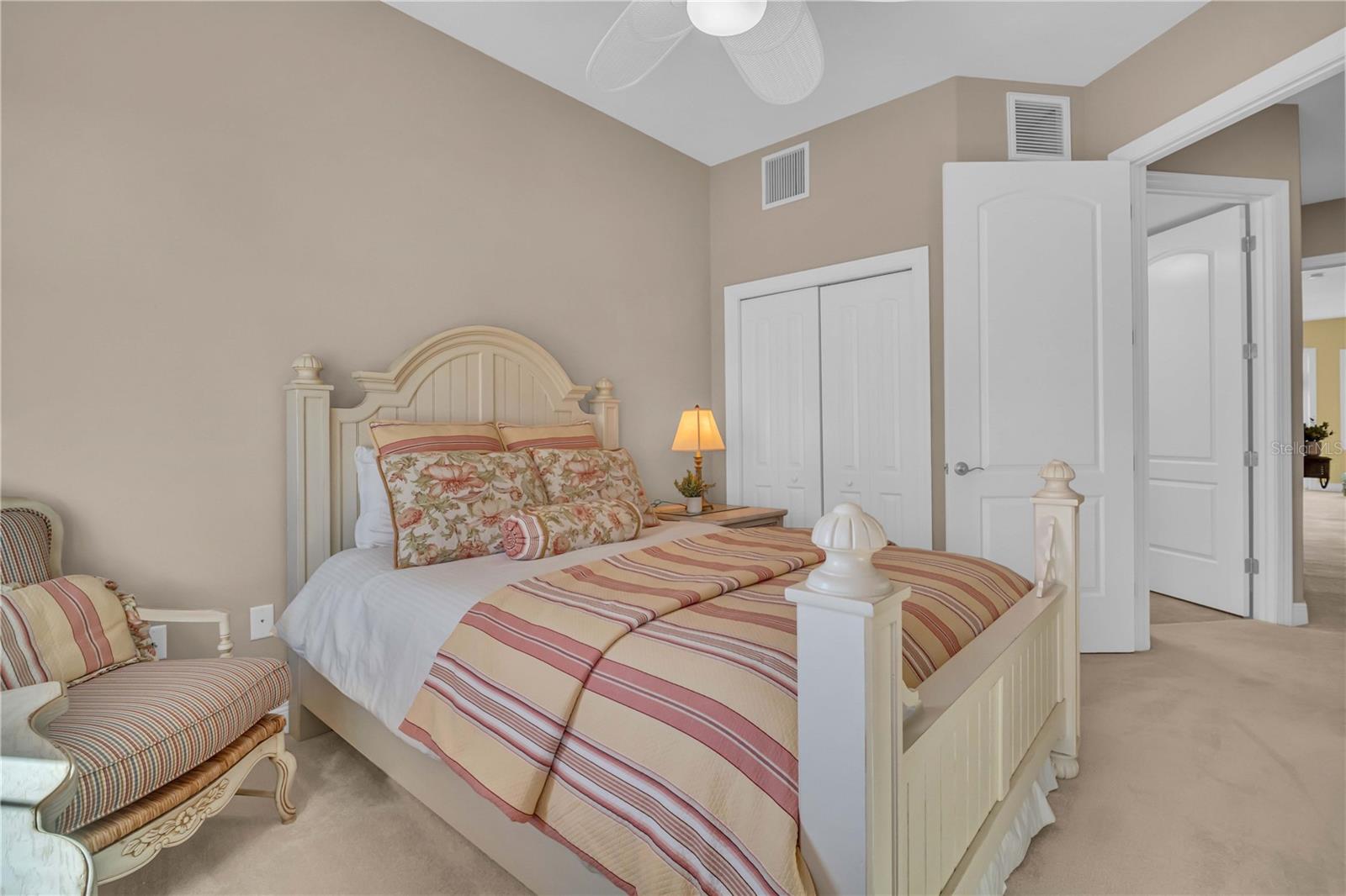 Cozy third bedroom with lots of natural lighting and a built in closet.