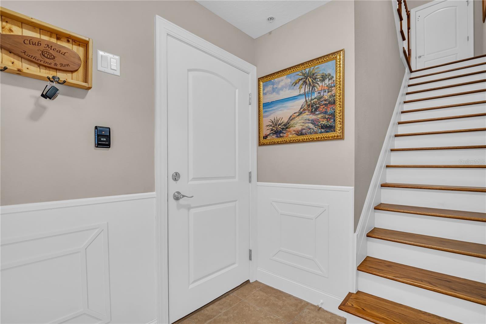 Entryway leading to garage or upstairs to the second level.