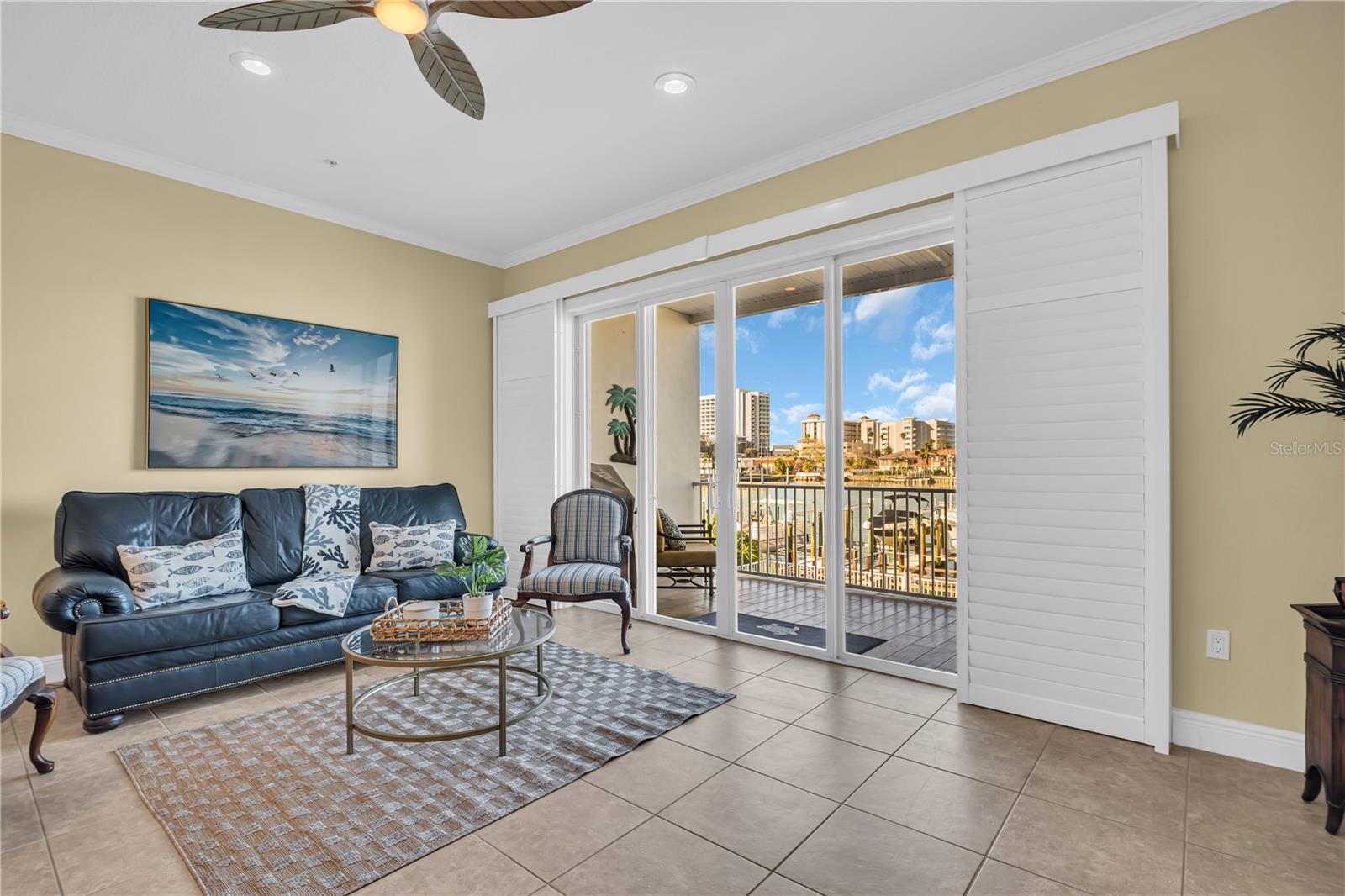 Chic living room on second level with high impact sliding doors leading out to private balcony.