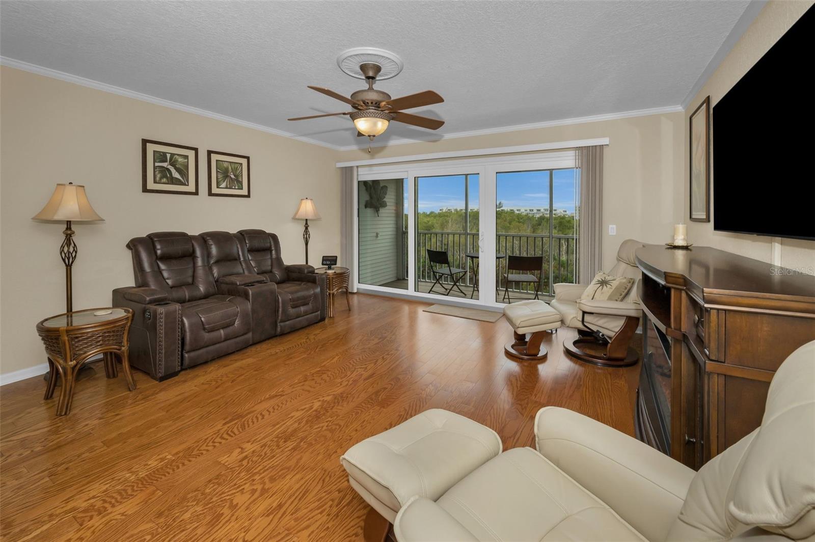 Main Level Living Room looking out to the screened balcony