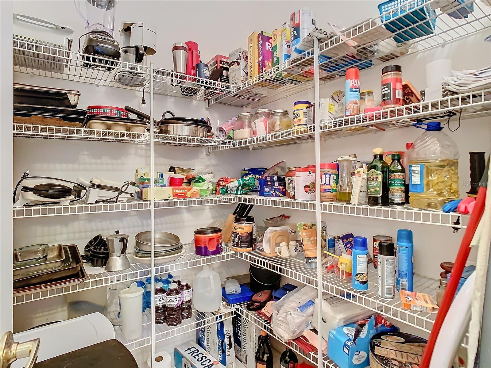 Do you require a lot of storage for your baking ingredients, pots and pans etc.? Well this walk in pantry off the kitchen will serve you well.