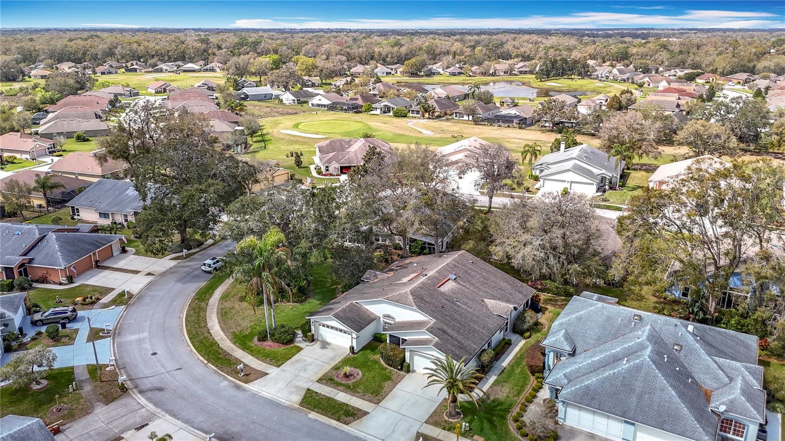 Aerial view of the property. Roof replacement was done in 2014 with assistance of HOA reserve fund. You can see the golf course at back of the picture.