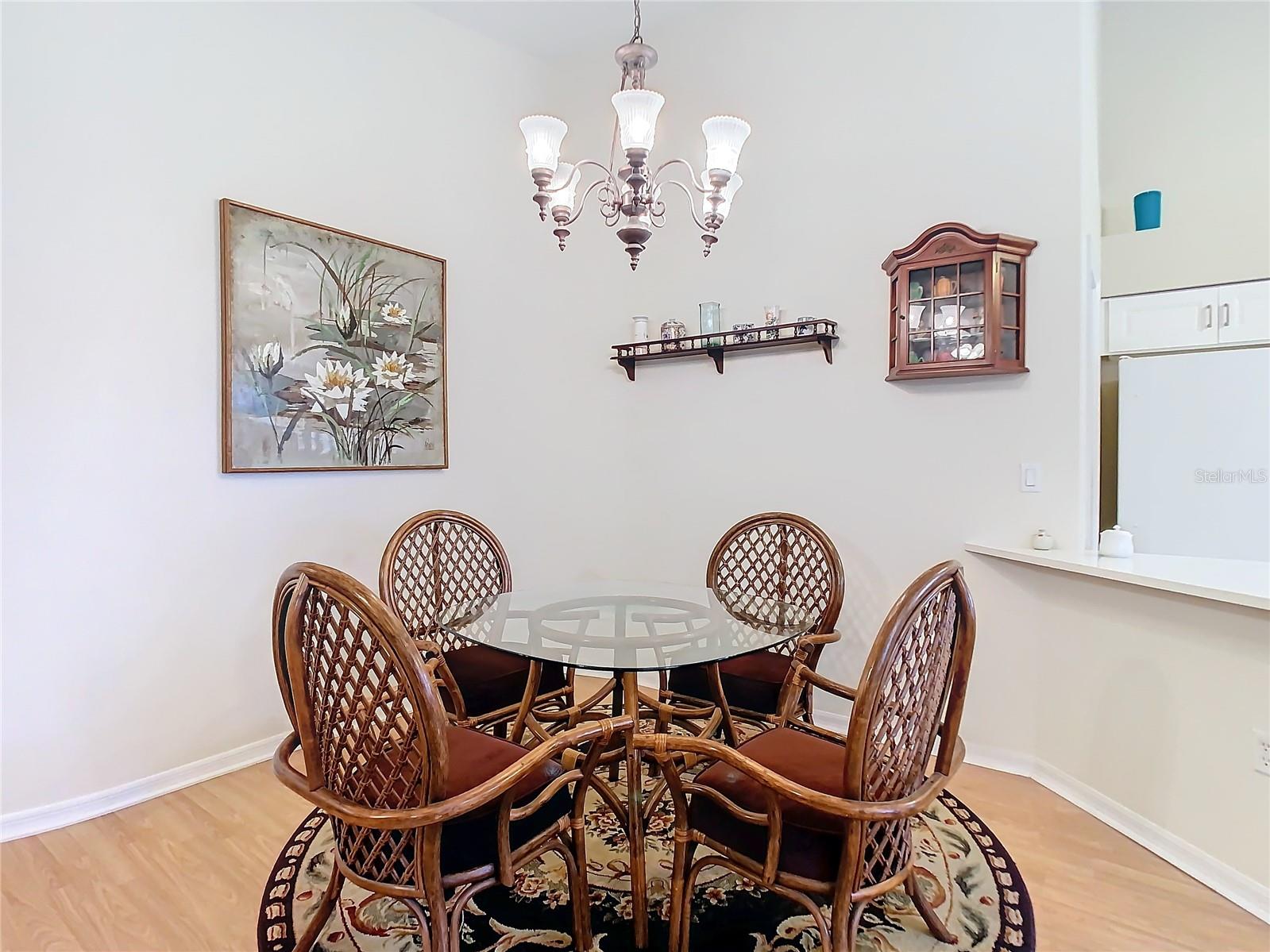 The dining area has a cozy feeling to it and has easy access to the kitchen. Room also sits on laminate flooring.