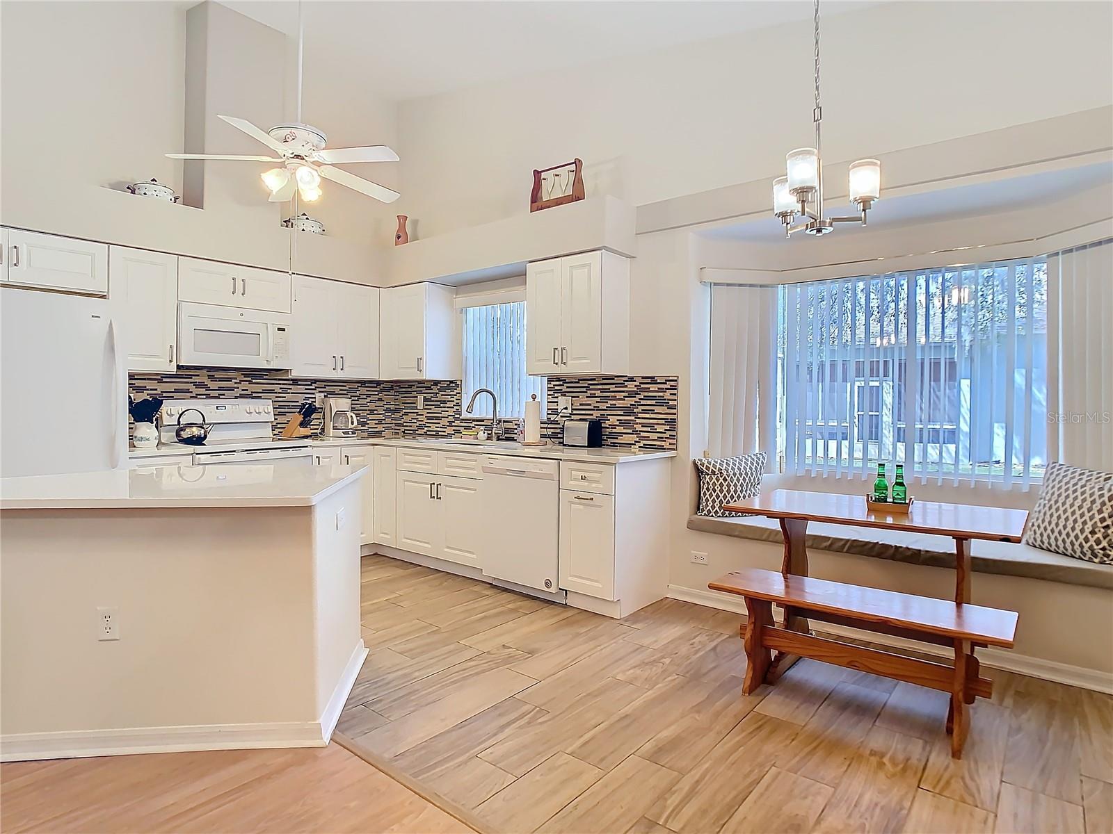 The kitchen area has ample space for for eating in as shown. The table stands in front of  a sit in bay window. You have a view of the back yard that has been nicely maintained. Start your day off with a cup of joe and a pleasant view.