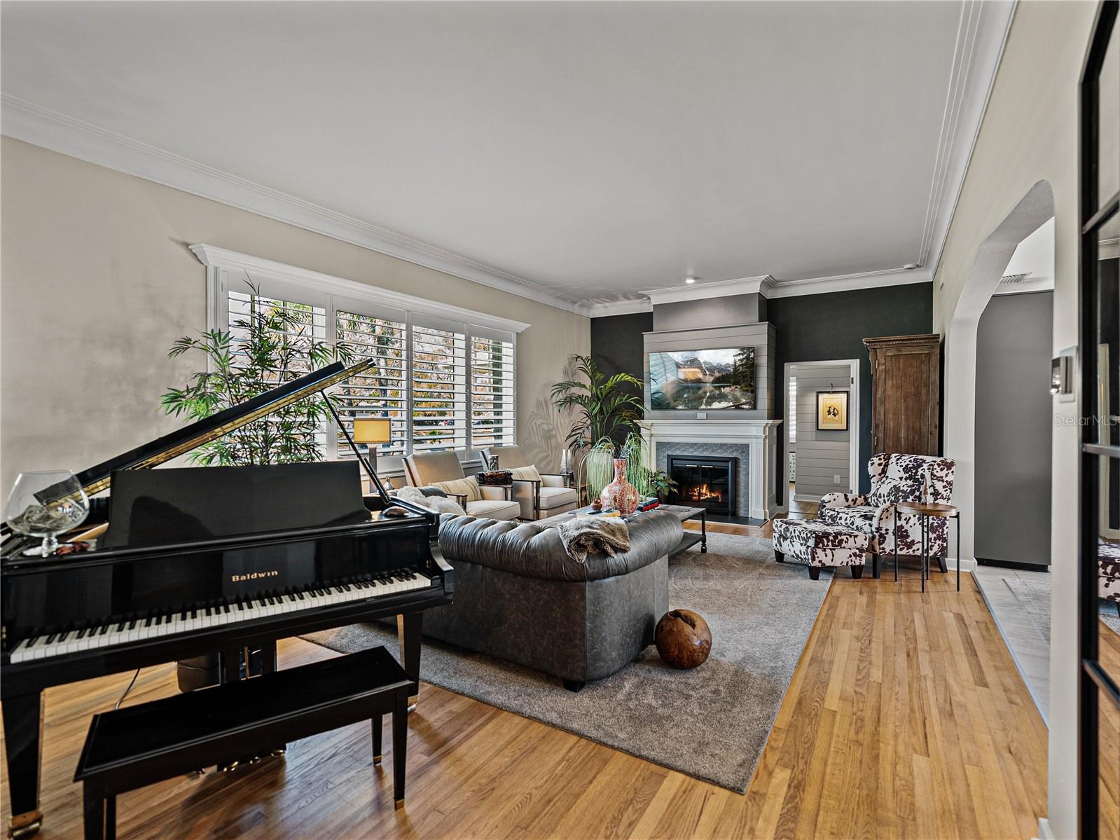 A wood burning fireplace take the cozy to next level in this incredible living room.