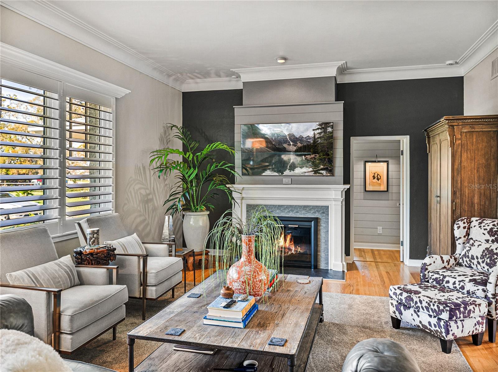 Plantation shutters add another touch of elegance to this living room.