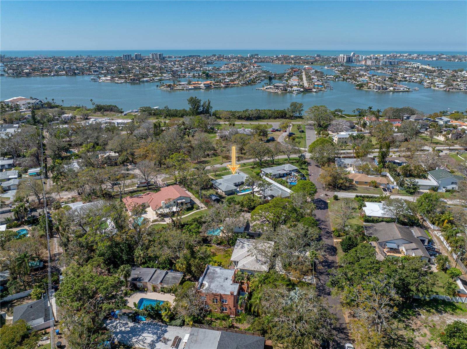 From the front of the house, you overlook Coconut Park with water views in the distance.