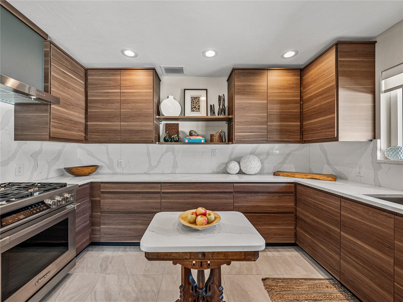 Beautiful modern kitchen with stunning quartz counters and backsplash.