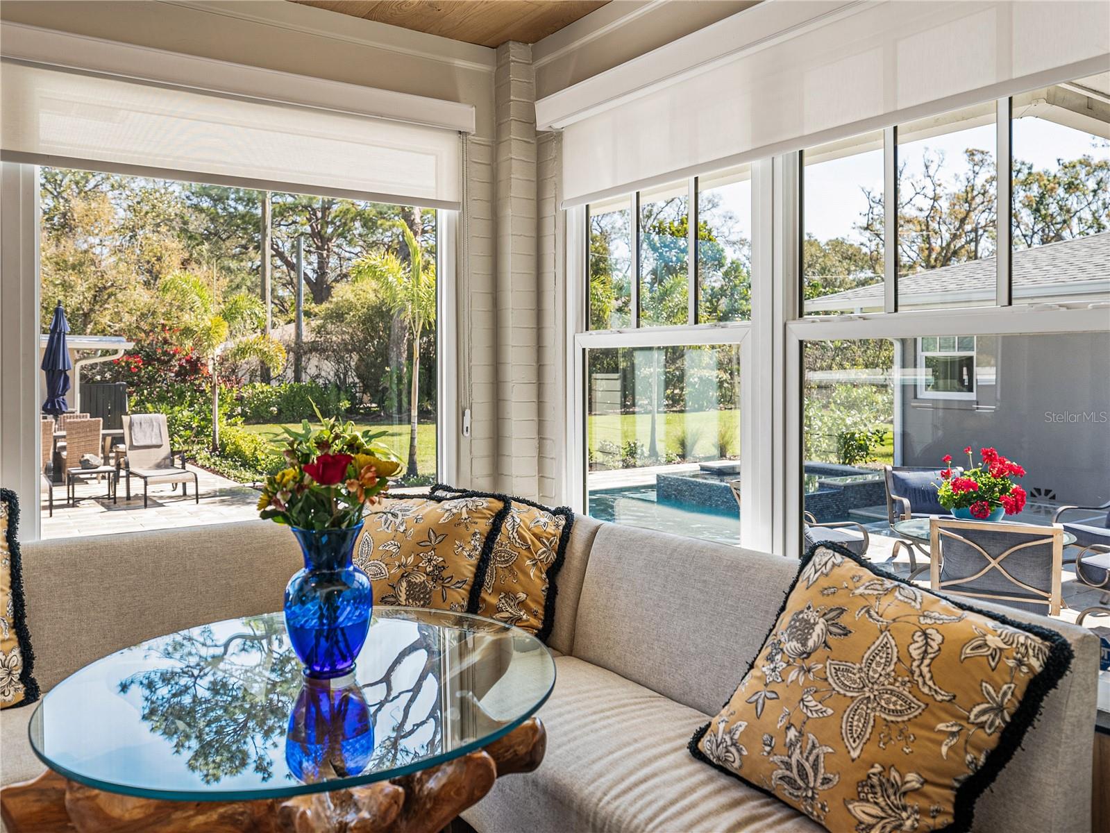 Cozy up in this banquette overlooking the pool while you sip your morning coffee.