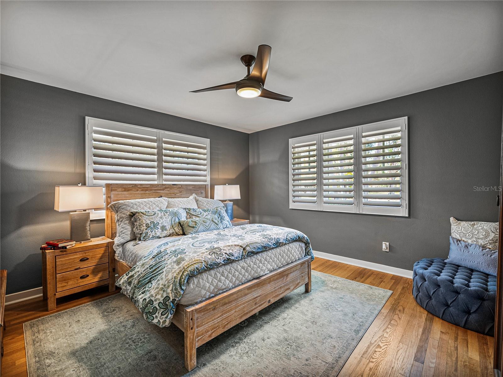 Bedroom 2 is oversized with plantation shutters and ample closet space.