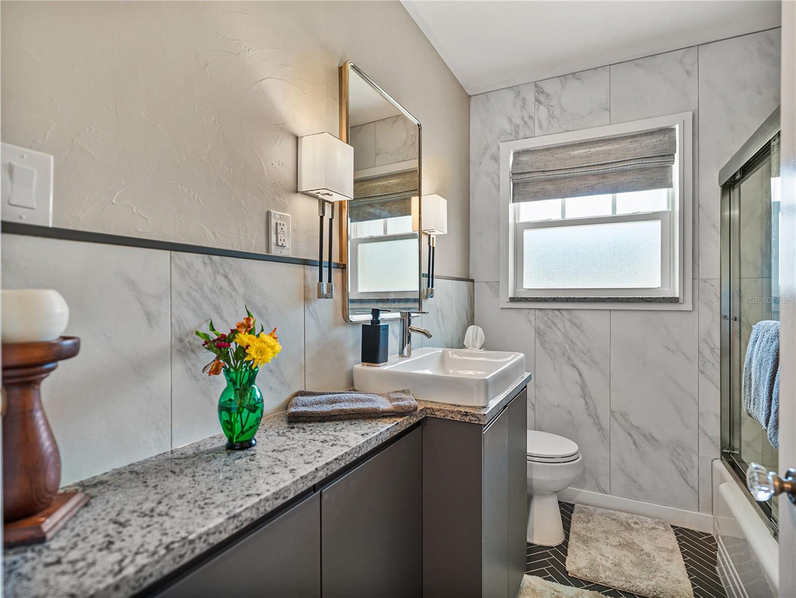 The completely transformed guest bathroom is stunning.