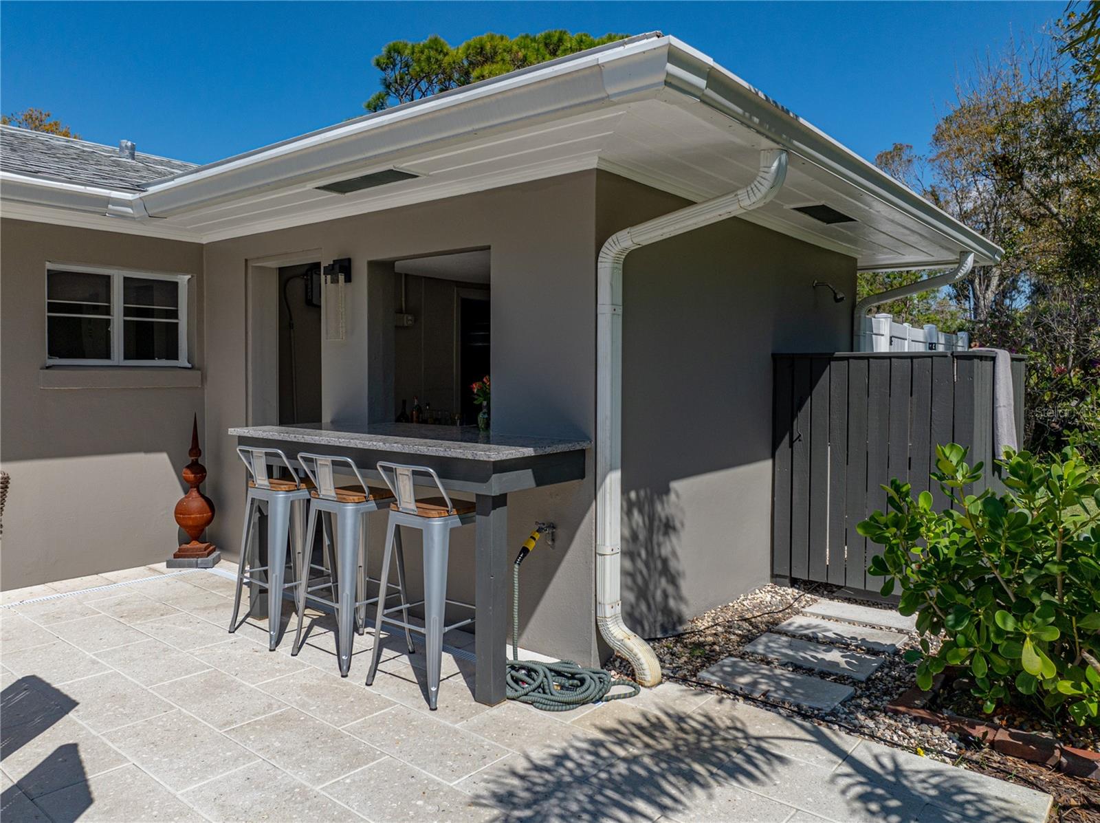 Outdoor bar with service window to the Summer kitchen.