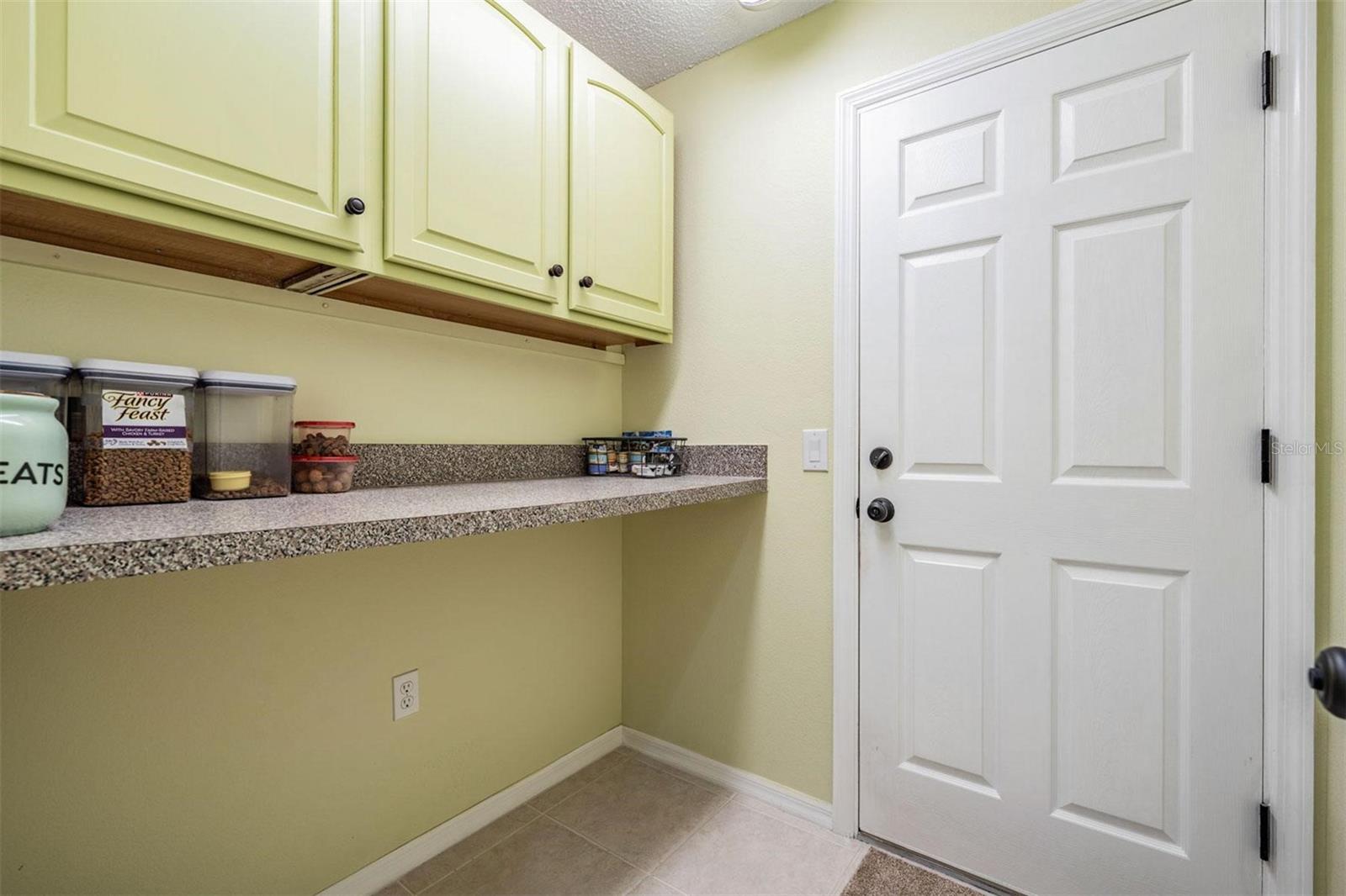 Walk-in utility room off the garage to make your own