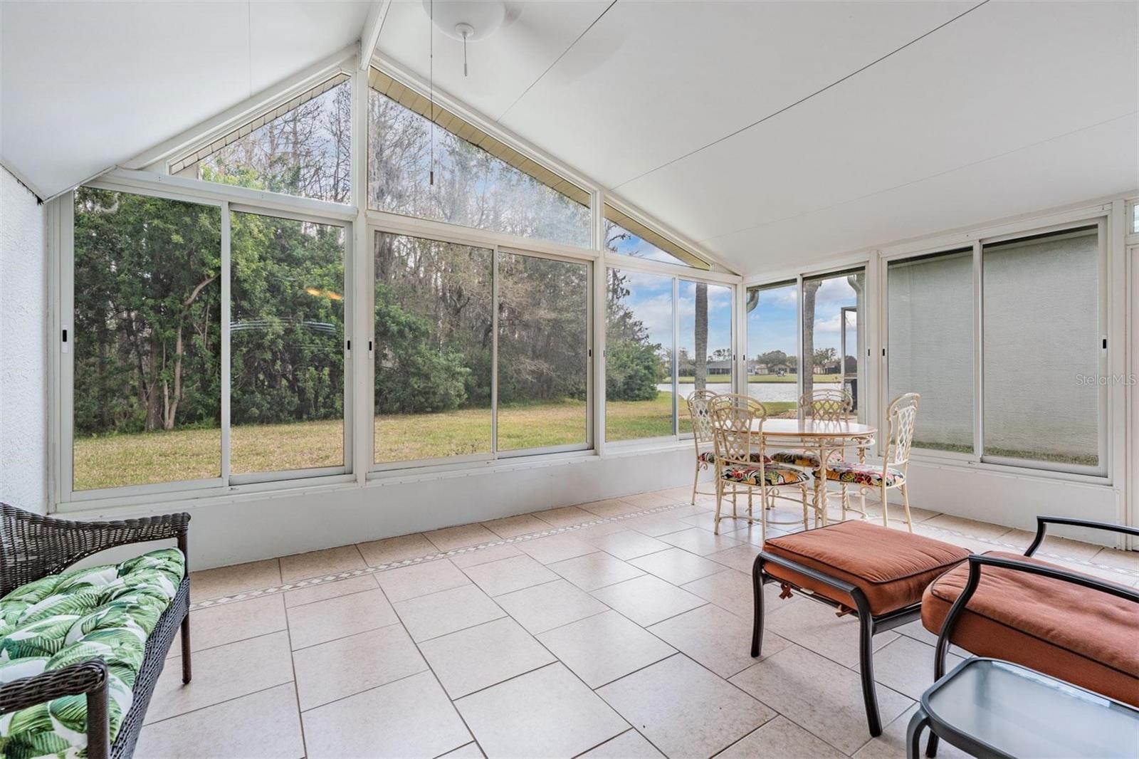 WOW! Expansive sunroom with vaulted ceiling