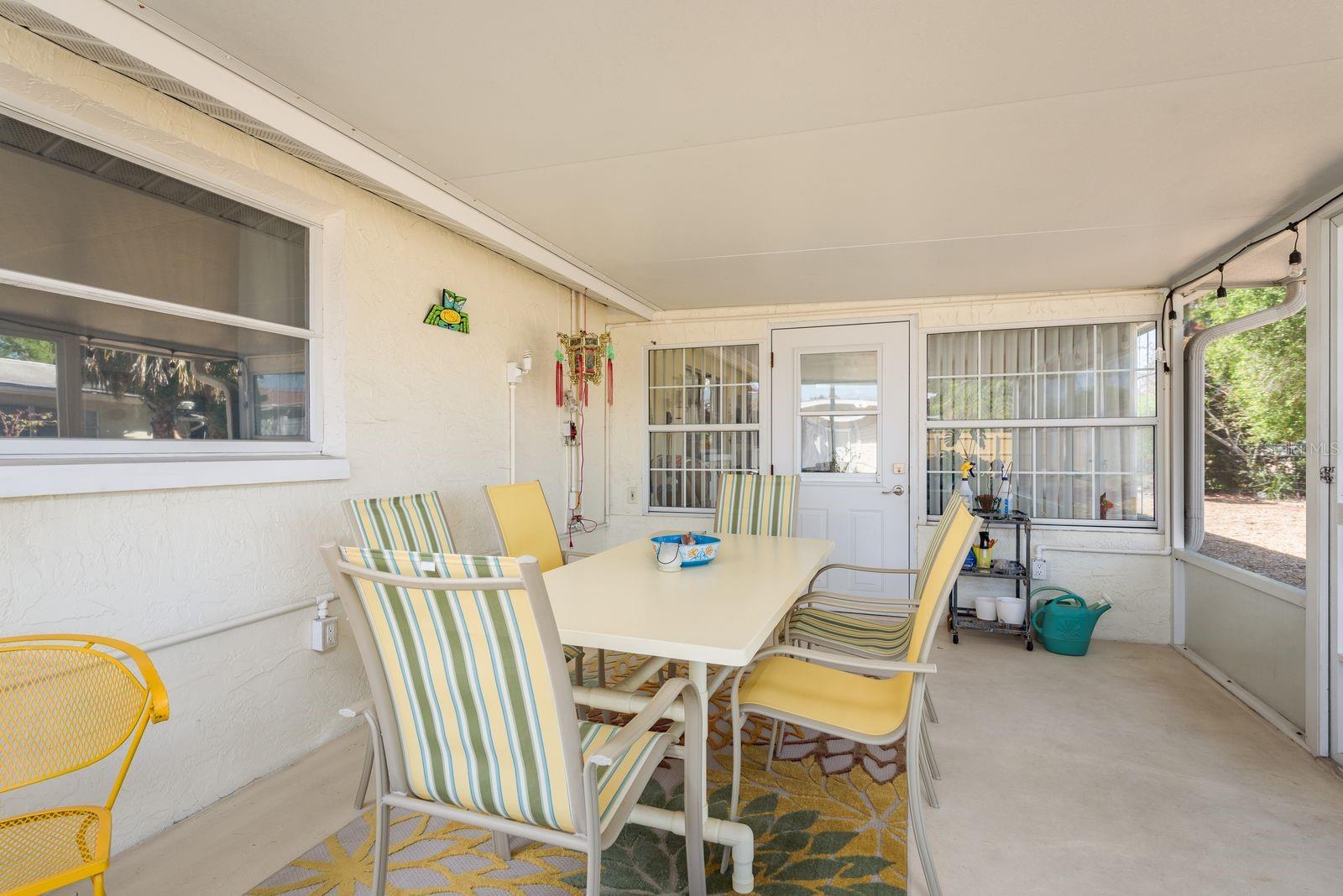 Another screened porch view showing door to Florida room.