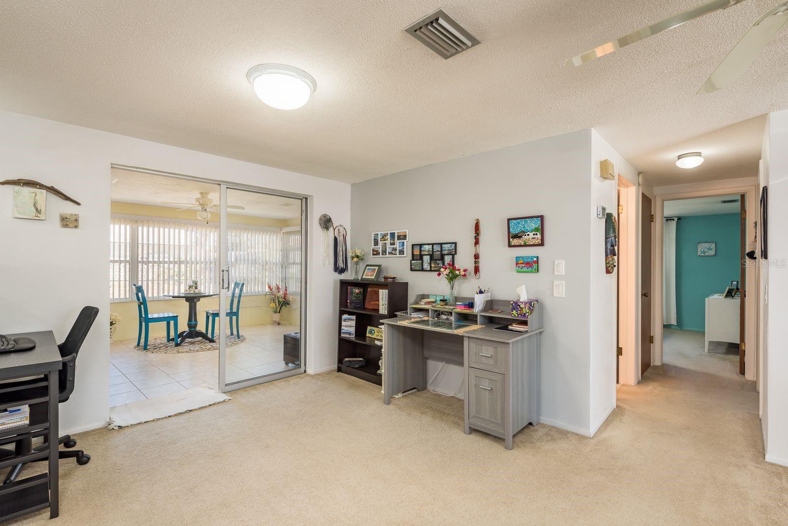 Dining area with sliders to Florida room.