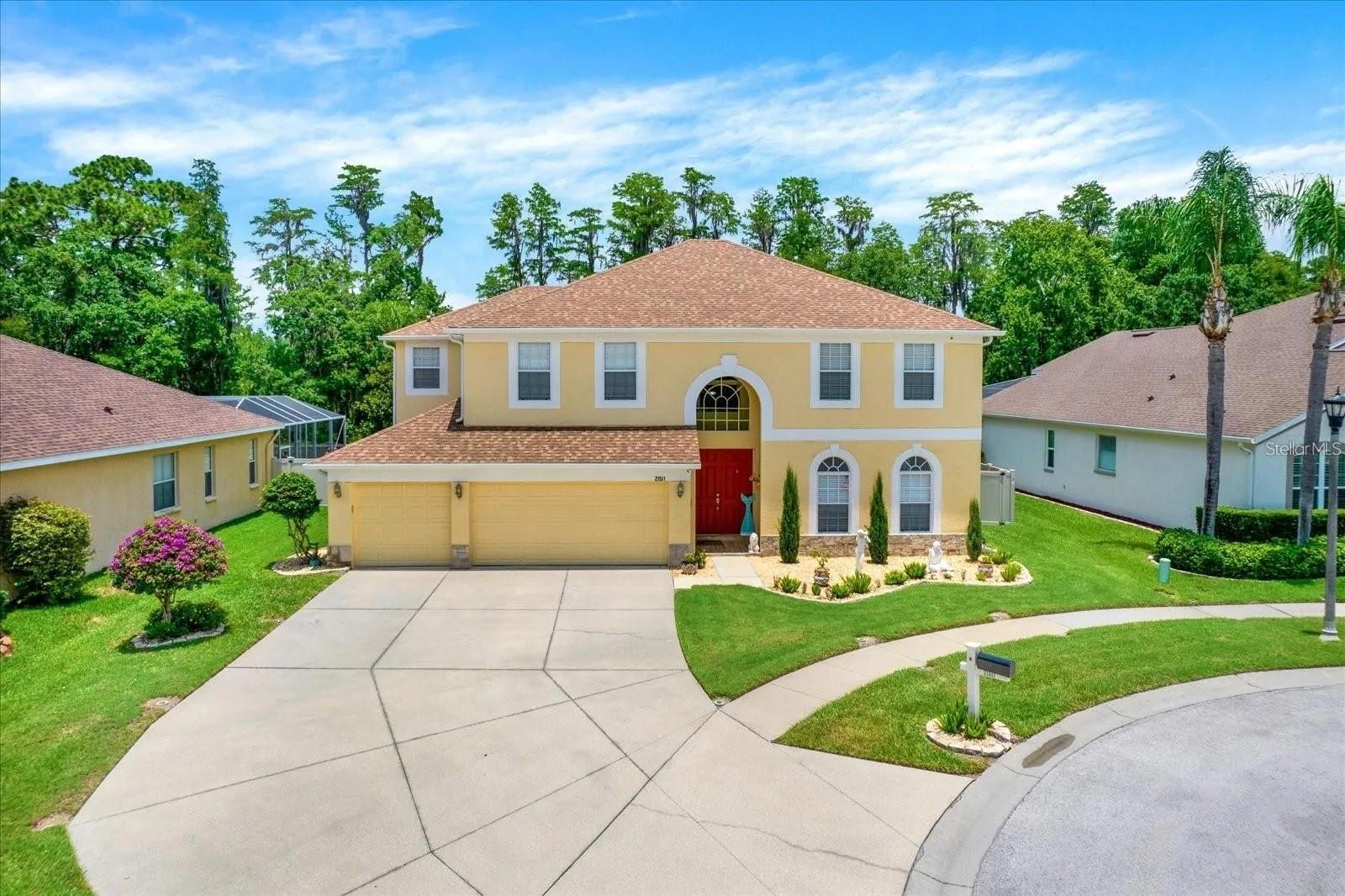 Oversized lot home features 6 bedrooms, 3 full bathrooms, and 3 car garage with an oversized driveway