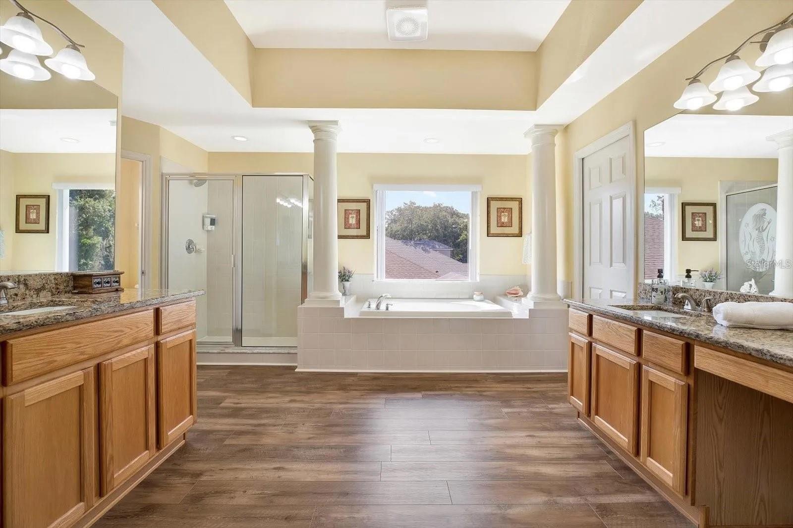 Separate dual sinks with garden tub, separate shower and 2 individual walk-in closets