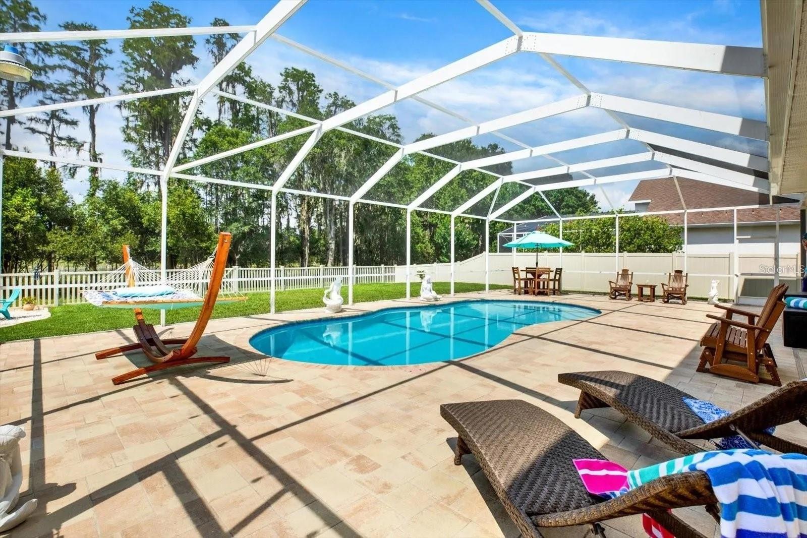 Pool overseeing gorgeous backyard, fully fenced with door for easy access to conservation