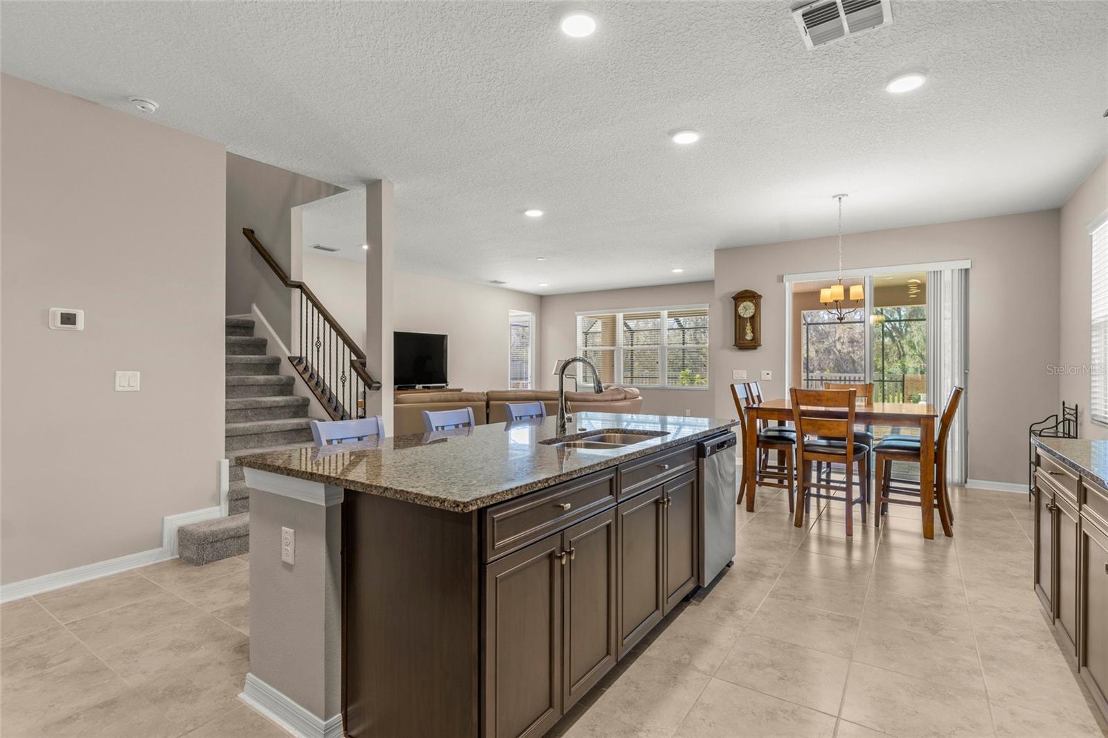 Kitchen island, stair and informal dining