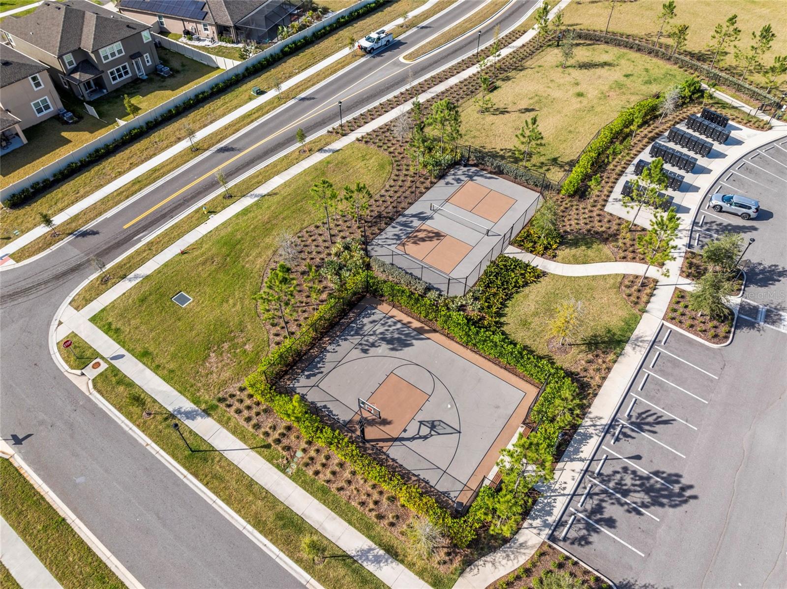 Bird's eye view of tennis court , basketball hoop.