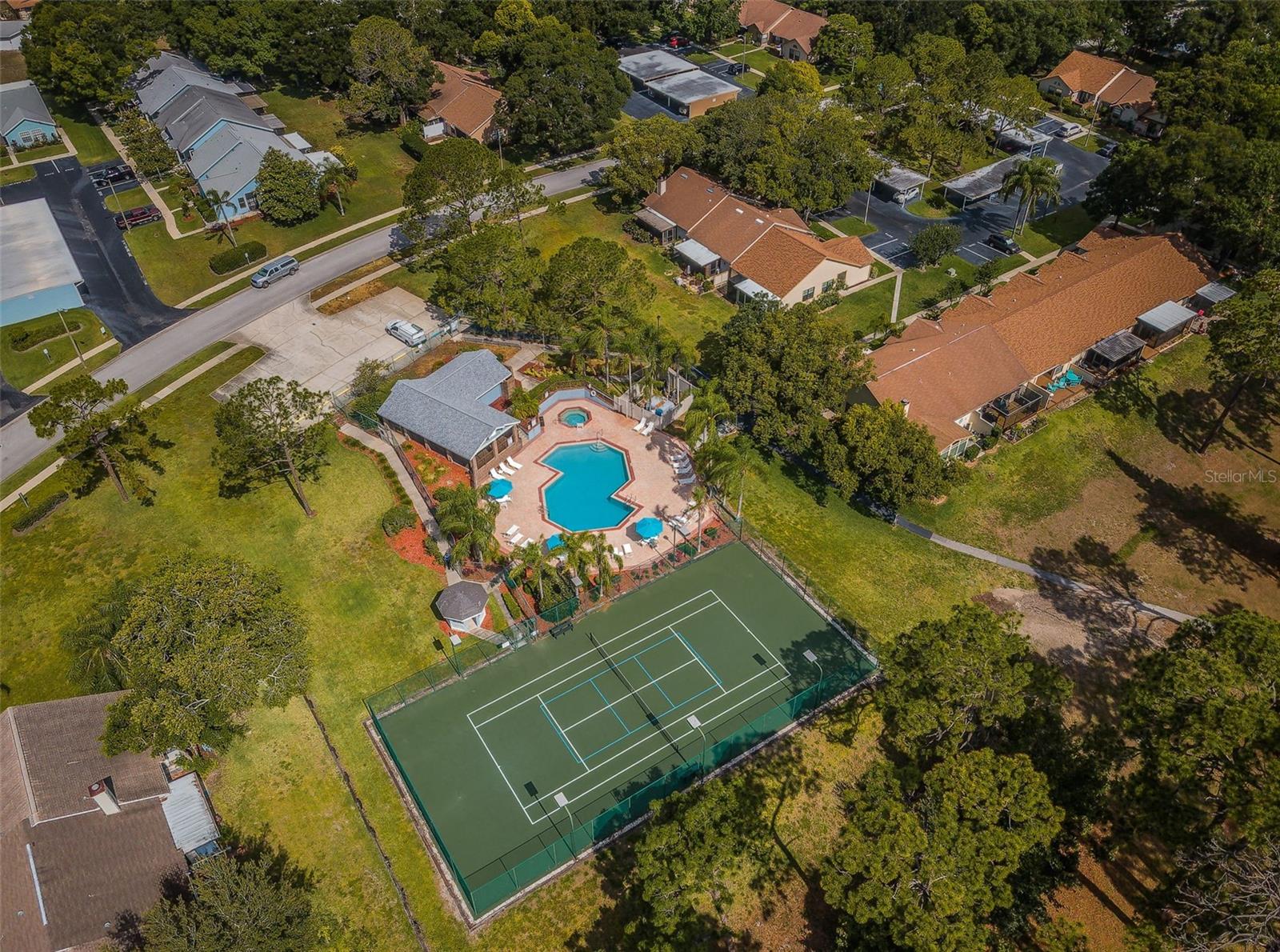 Aerial view of pool and courts