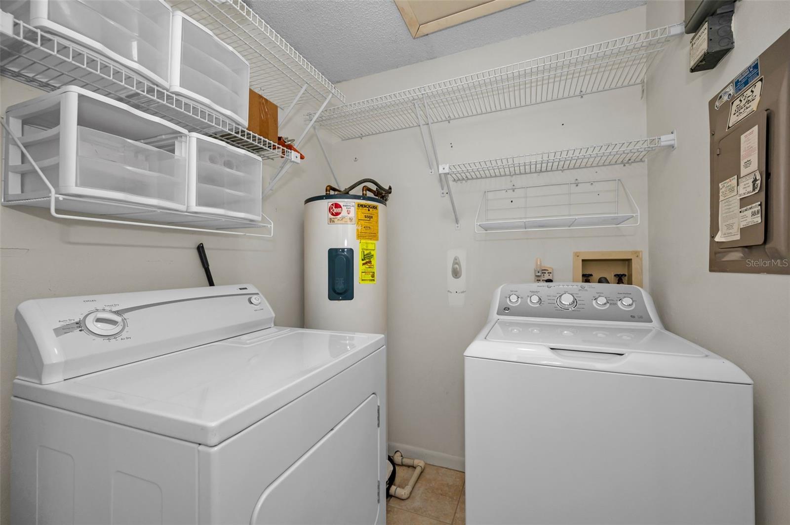 Inside laundry room with extra storage shelving