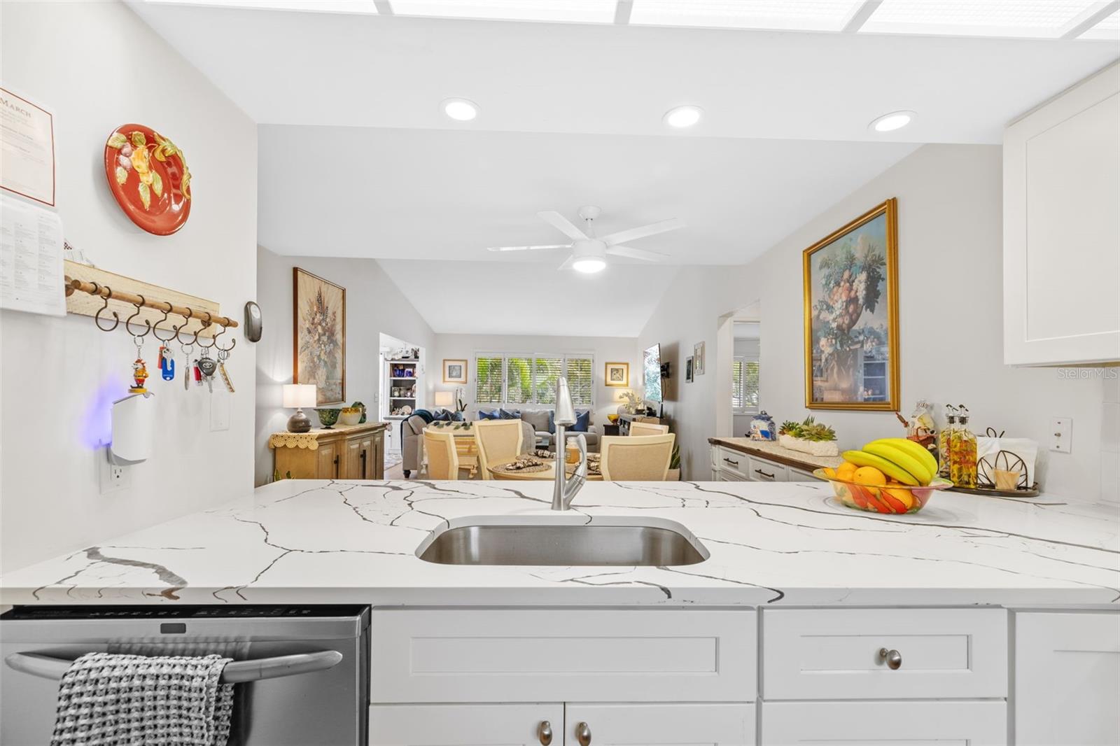 KITCHEN WITH VIEW OF EATING AREA AND GREAT ROOM