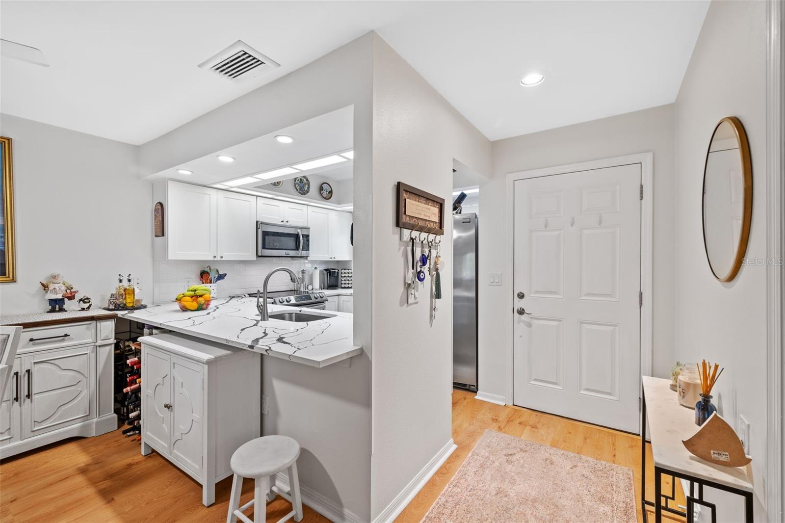 FRONT ENTRANCE WITH VIEW OF KITCHEN