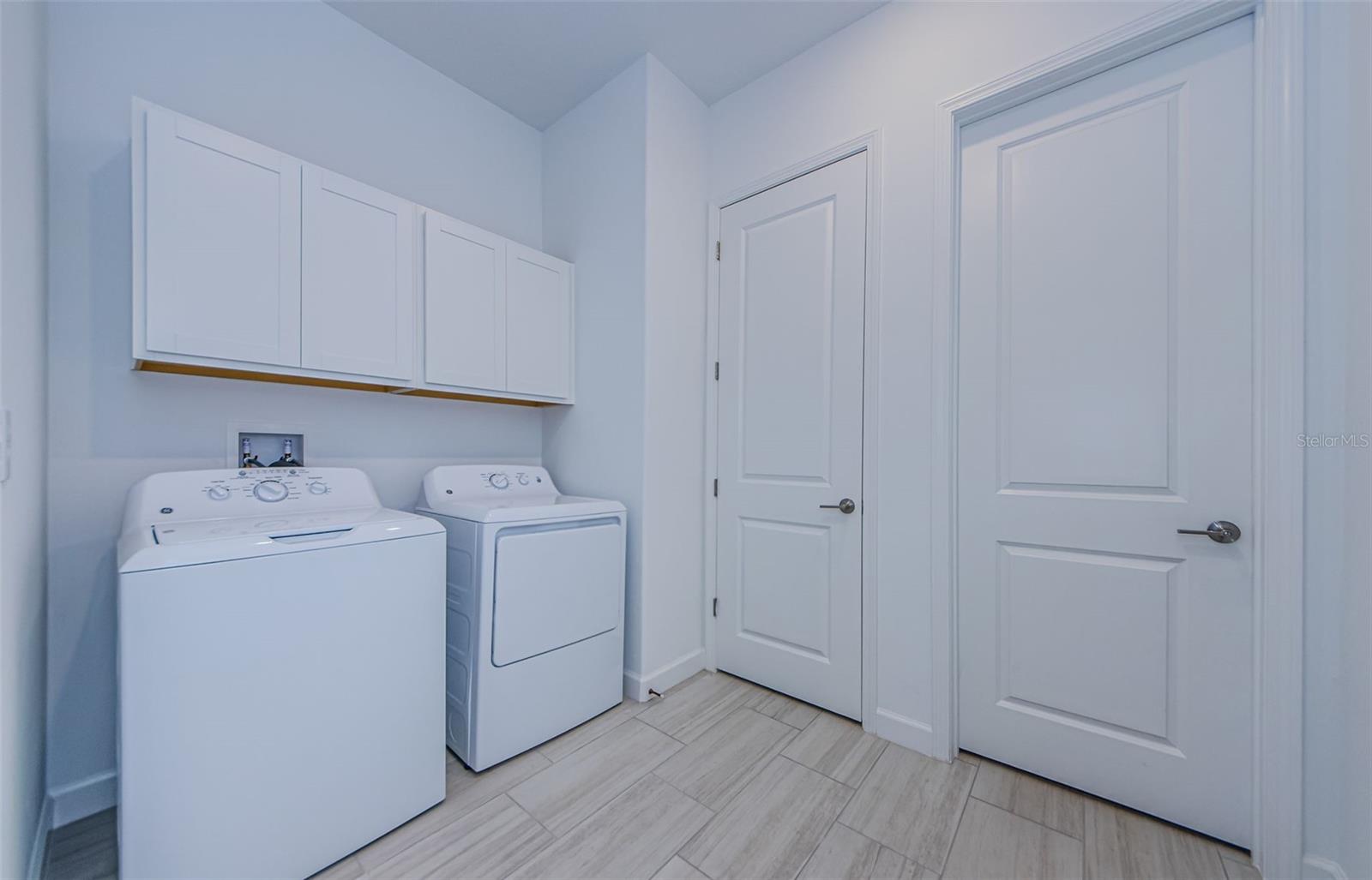 Large Laundry Room with Access to Primary Closet