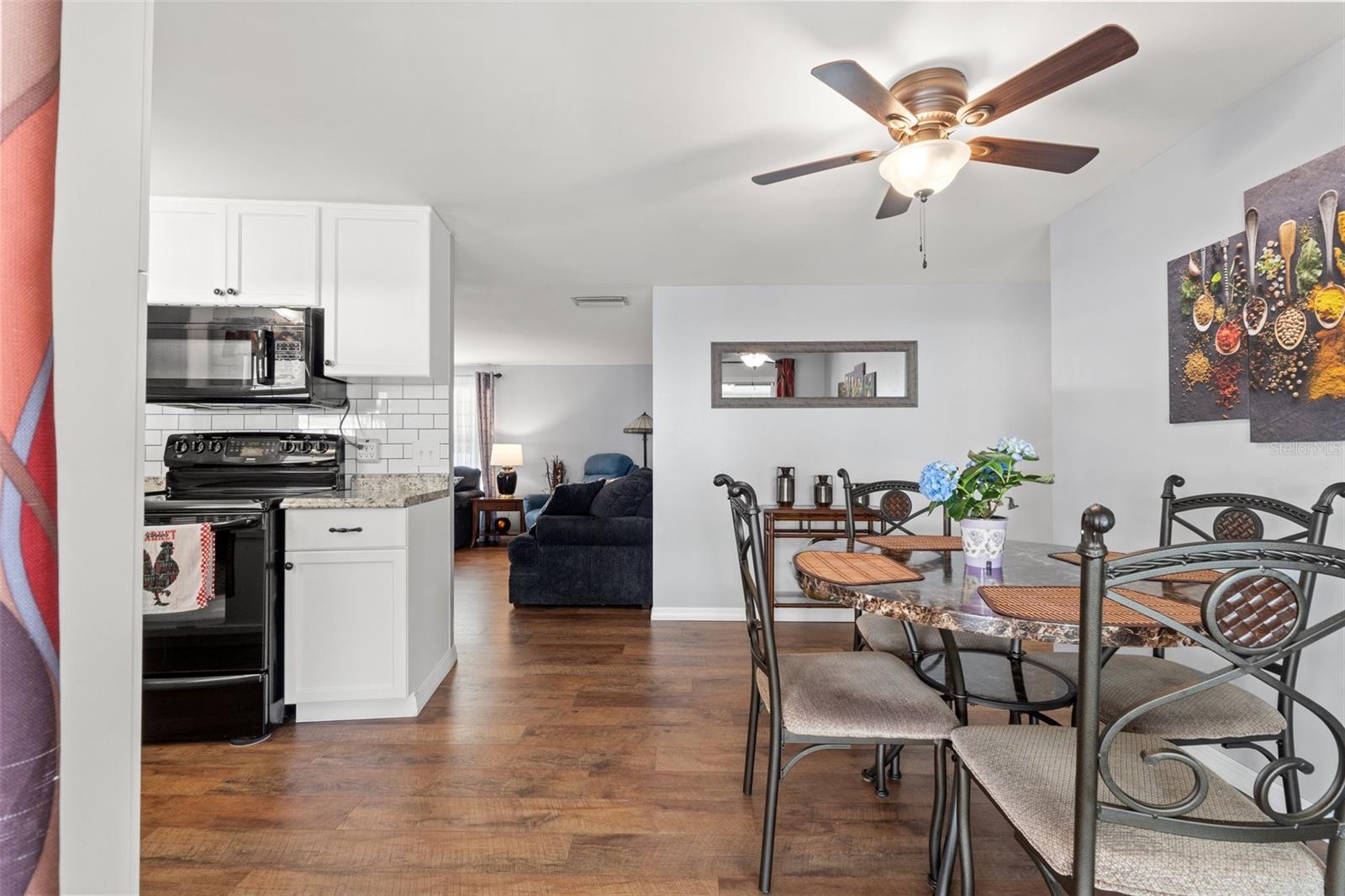 Entry from screened room to breakfast nook & kitchen