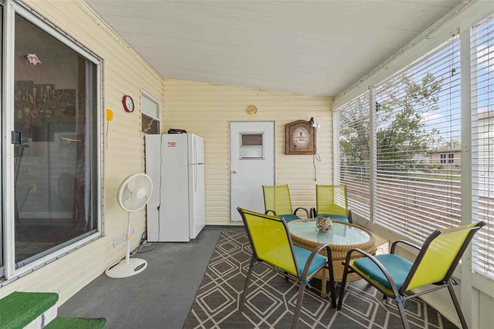 screened porch - refrigerator and furniture included