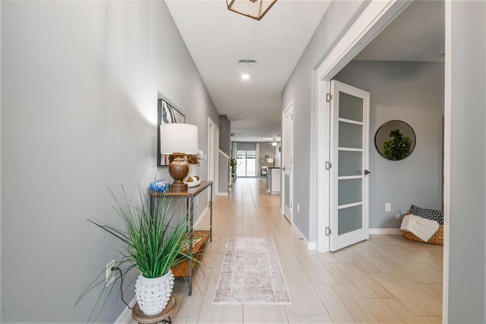 Large entry with updated french doors in flex room