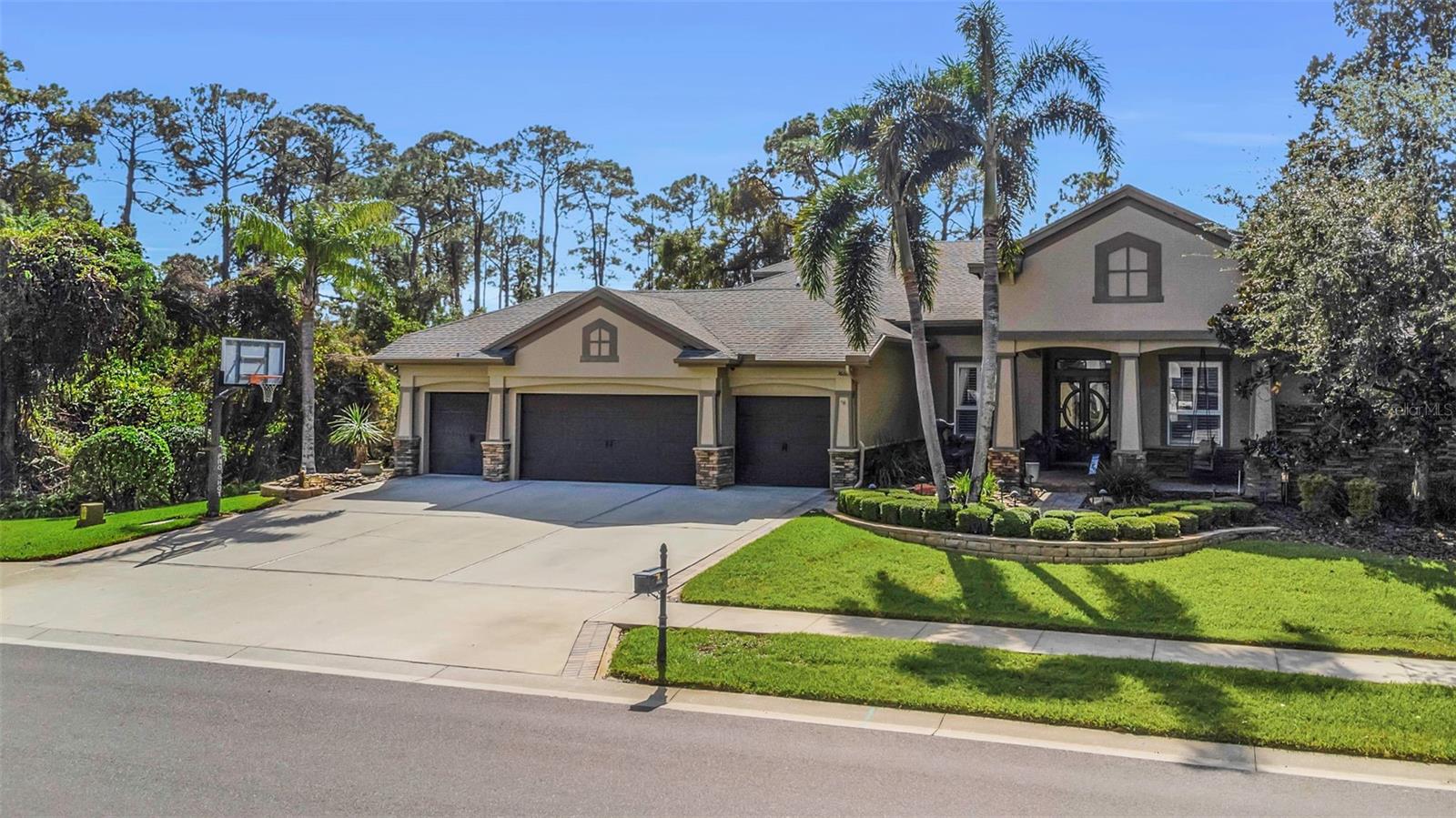 Four car garage on a corner lot and no neighbors to the left or rear.