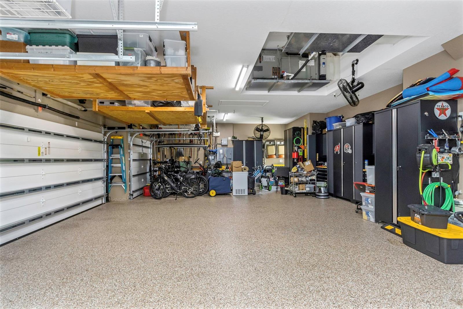 Four car garage with epoxy flooring.