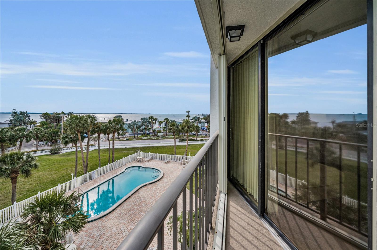 Stunning view of the heated pool, and Gulf of Mexico from your private balcony!