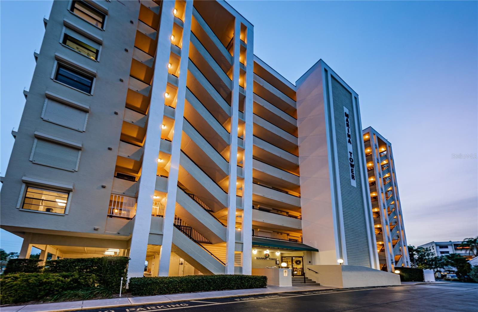 A stunning twilight picture at sunset showing entire building from the North side and main entrance.