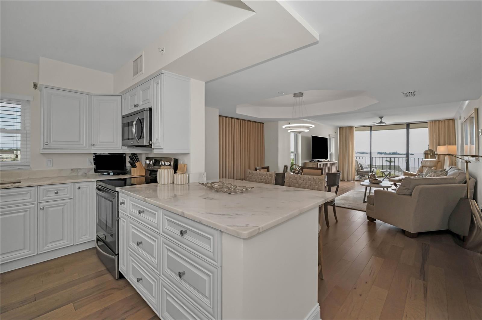 Kitchen with solid wood cabinets, opened up to include better water views!