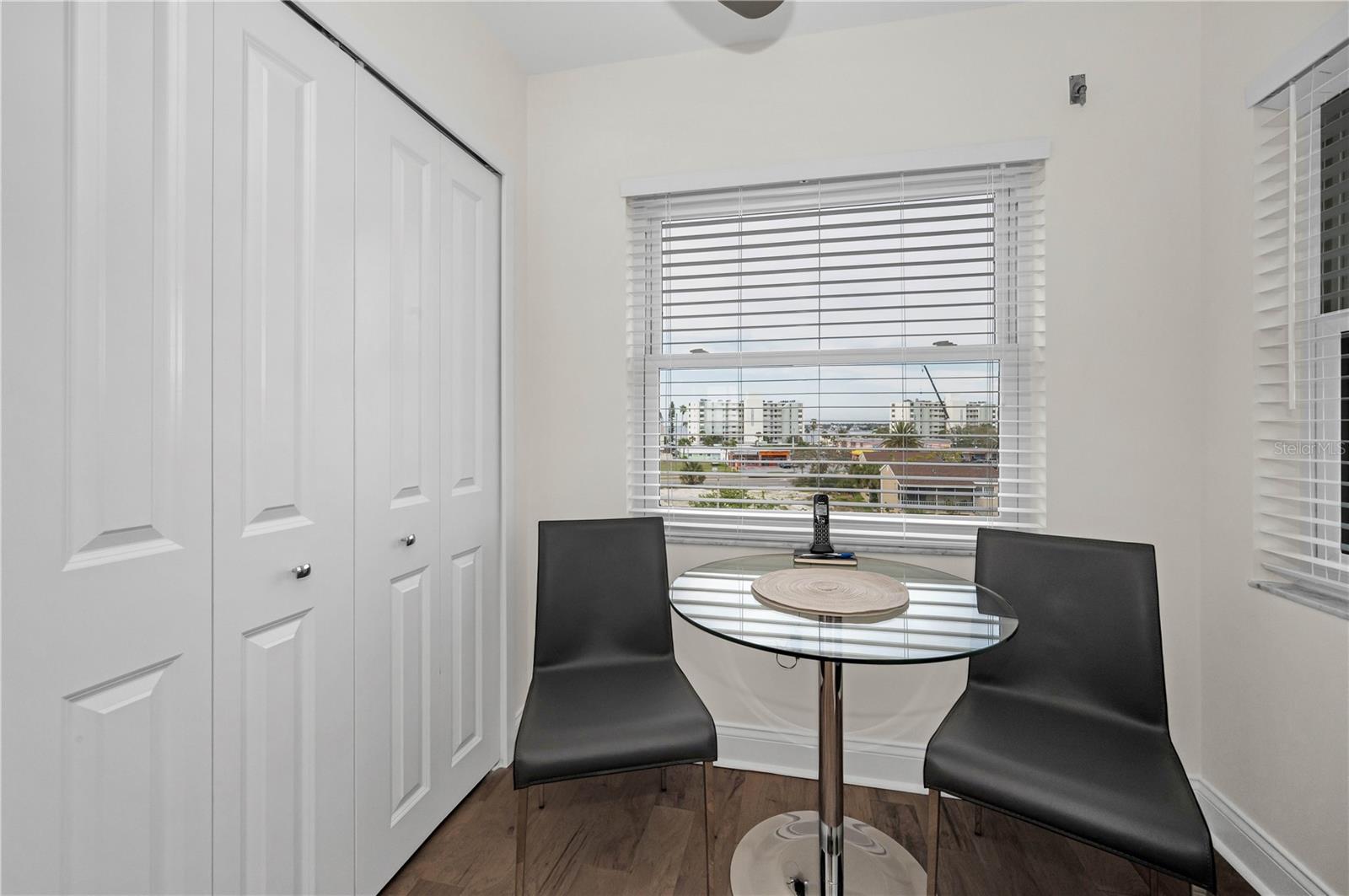 In Kitchen dining area with glass table and leather chairs!  Classy!