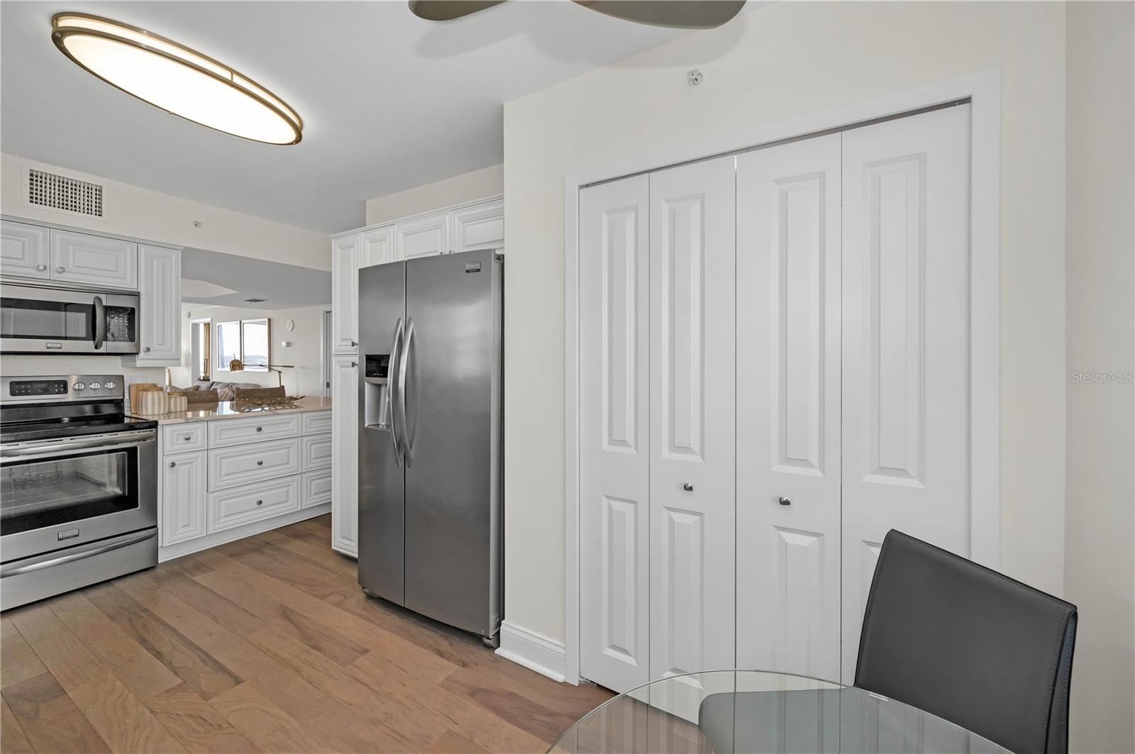 Laundry Closet with storage in kitchen.