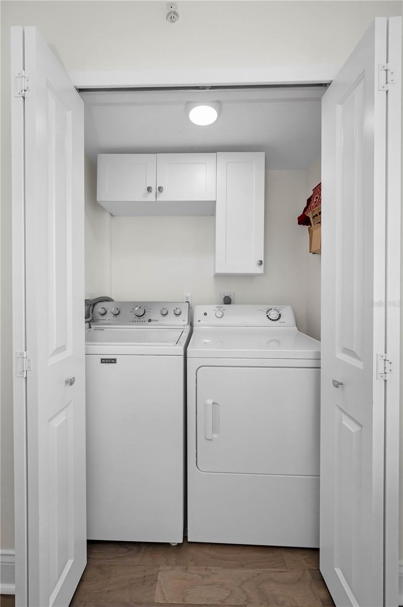 In kitchen, washer and dryer