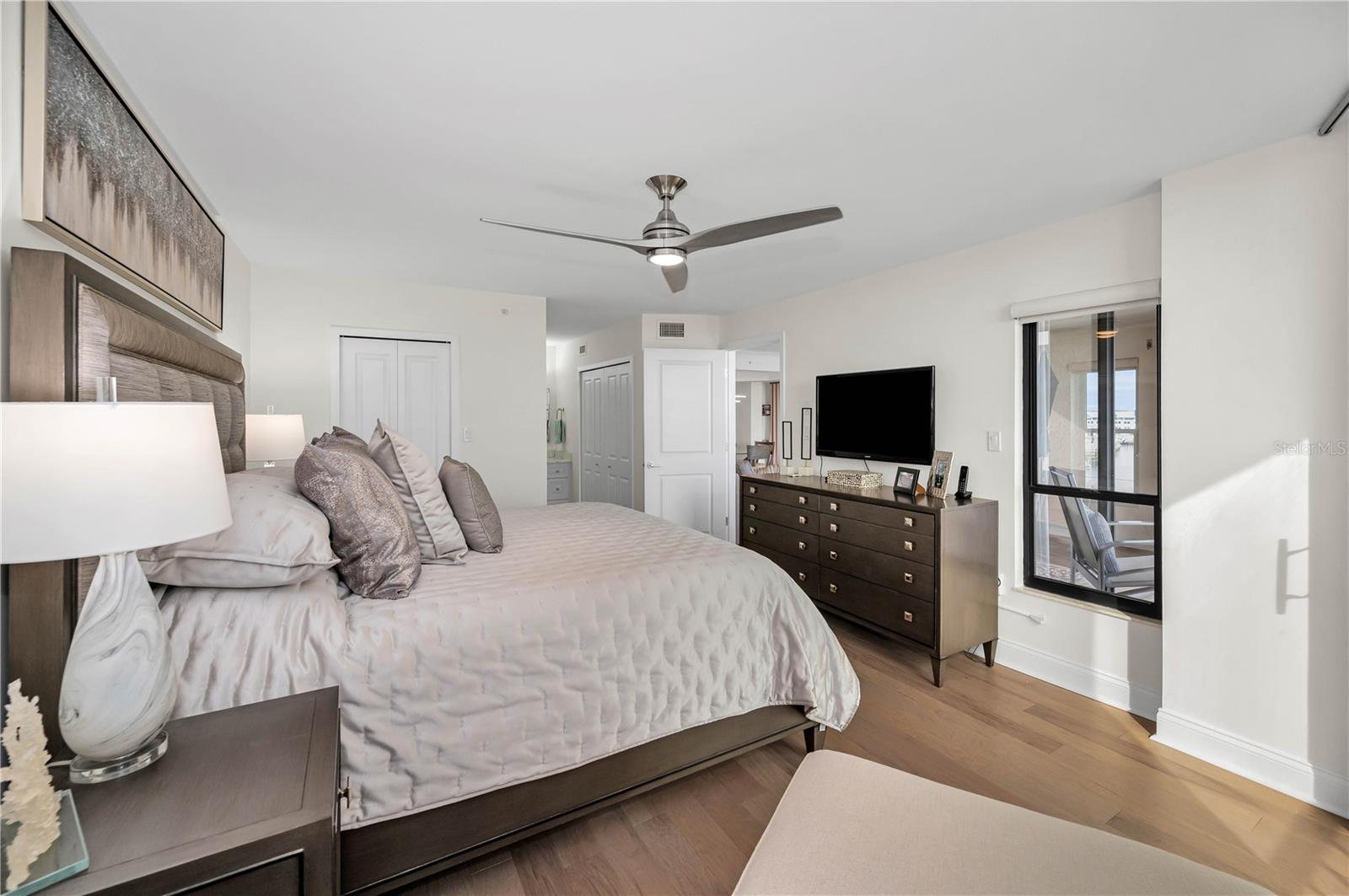 Master suite with ensuite beyond.  His and hers closets, private shower and toilet area, and private vanity area.