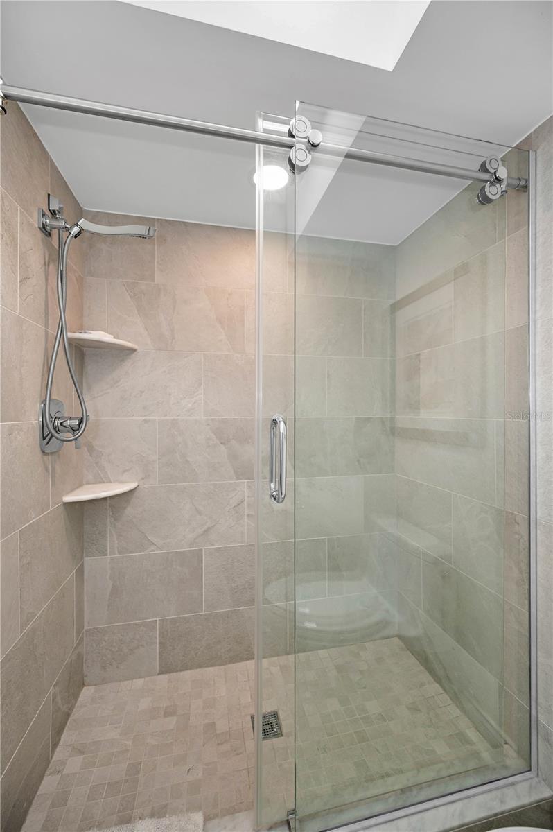 Primary Bathroom Shower with light touch rollers the slide and glide the doors!