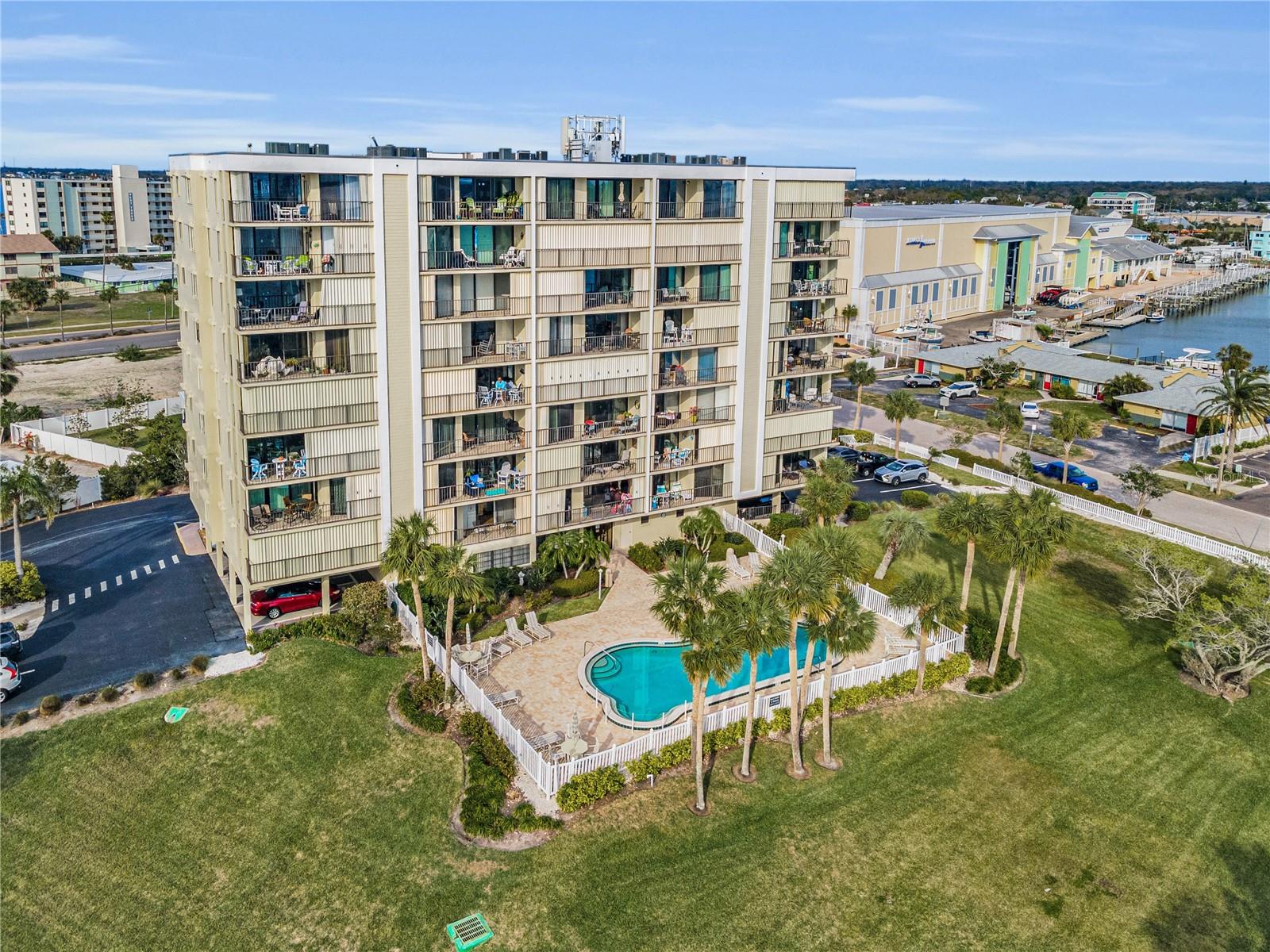 South or back side of building with private heated pool.  No flooding to this building in any hurricanes!!  See how close Marina is to your right.  Keep your boat at the Marina and when ready to go out, call ahead and your boat will be ready for you to take to the waters!